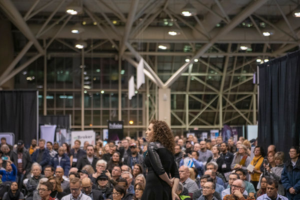 Image of Lindsay Adler Standing on Stage in front of Audience