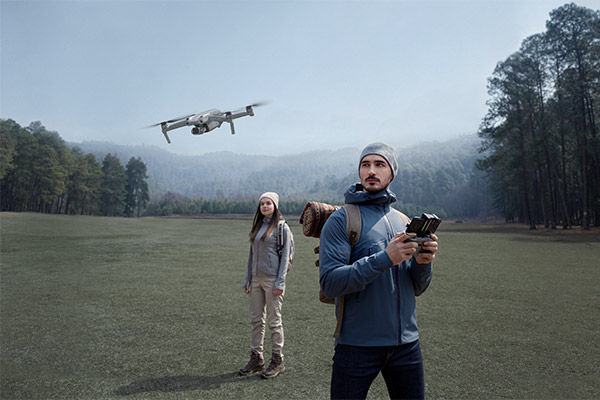 Image of drone operator in open field