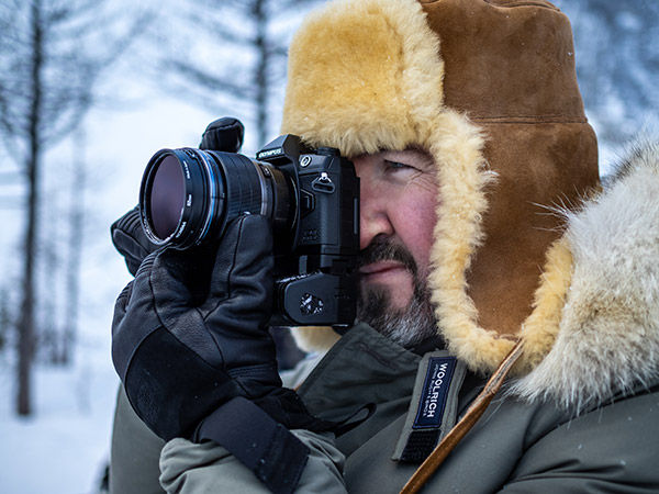 lifestyle image of man using camera