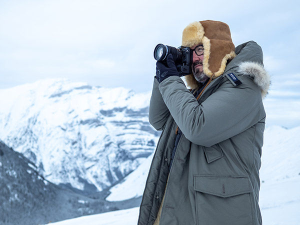 lifestyle image of man using camera